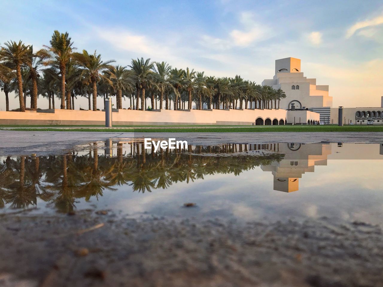 REFLECTION OF BUILDING IN LAKE