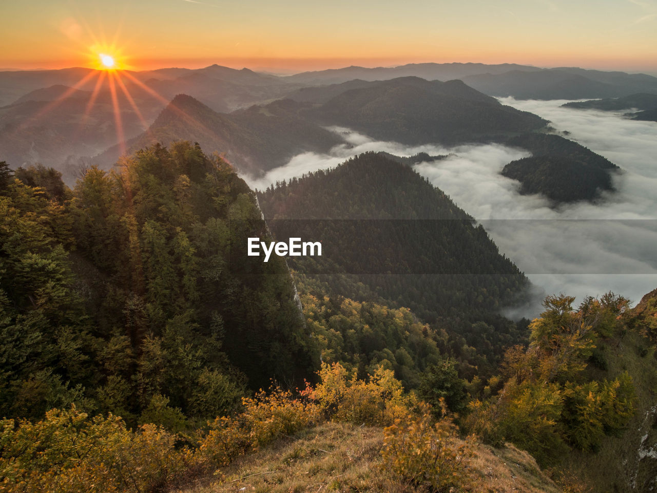 HIGH ANGLE VIEW OF MOUNTAINS DURING SUNSET