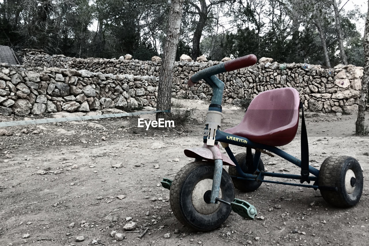 BICYCLE PARKED ON ROADSIDE