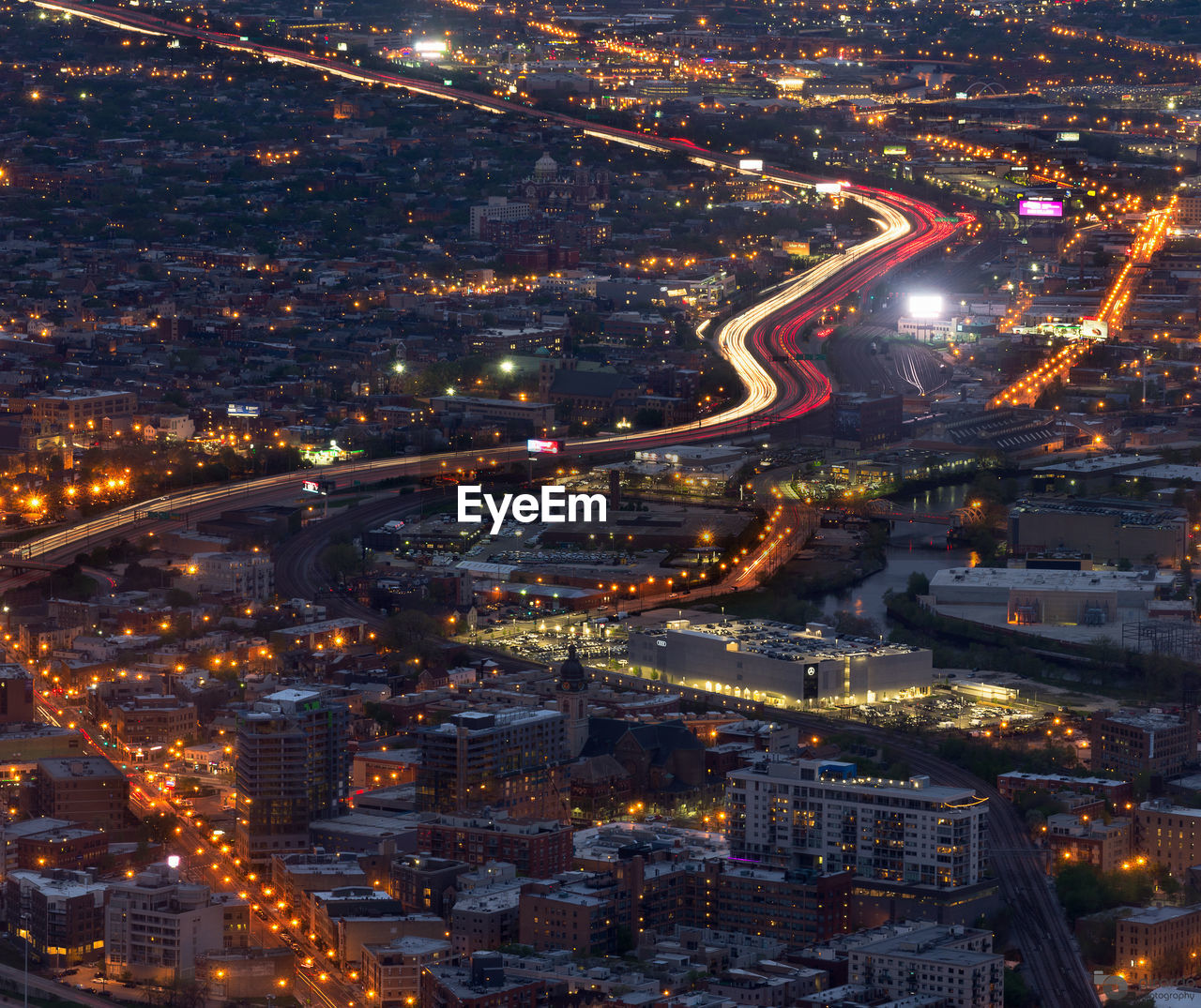 High angle view of city lit up at night