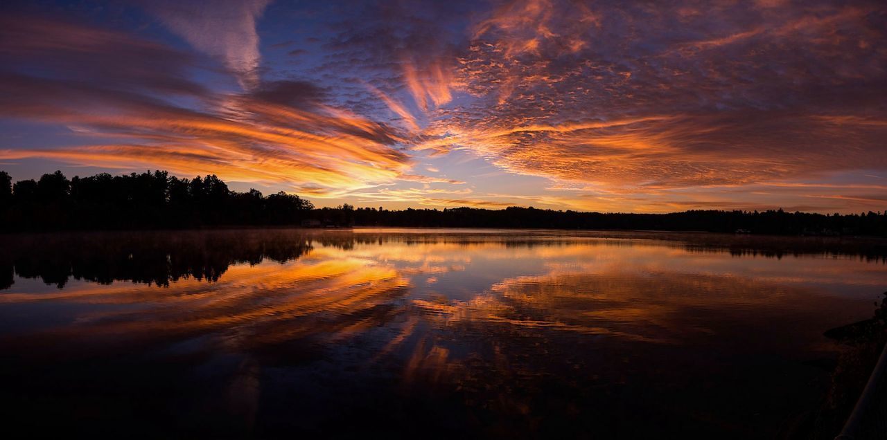 Scenic view of lake against beautiful orange morning sky