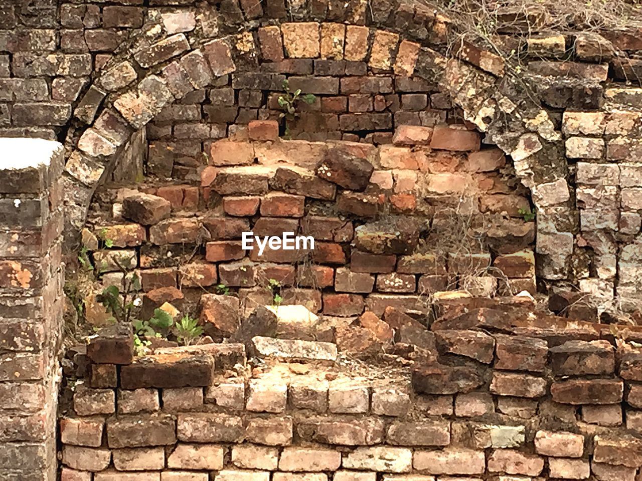 LOW ANGLE VIEW OF BRICK WALL WITH BRICK WALL