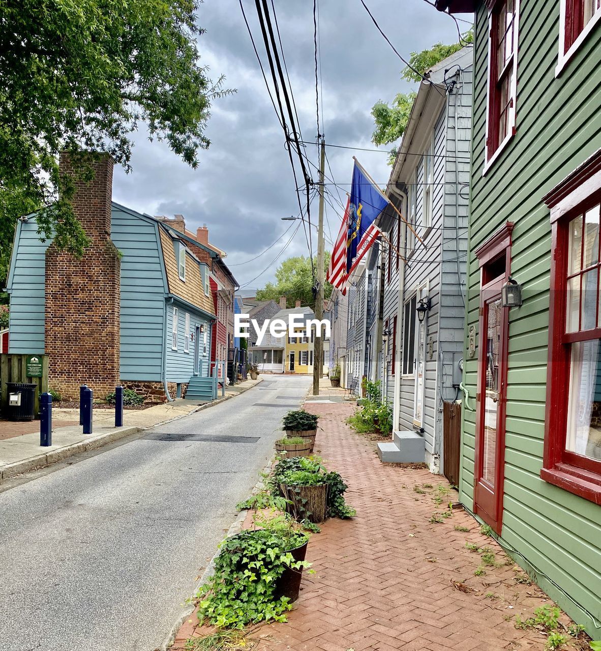 Colorful homes against cloudy sky on fleet street in historic annapolis, maryland. 