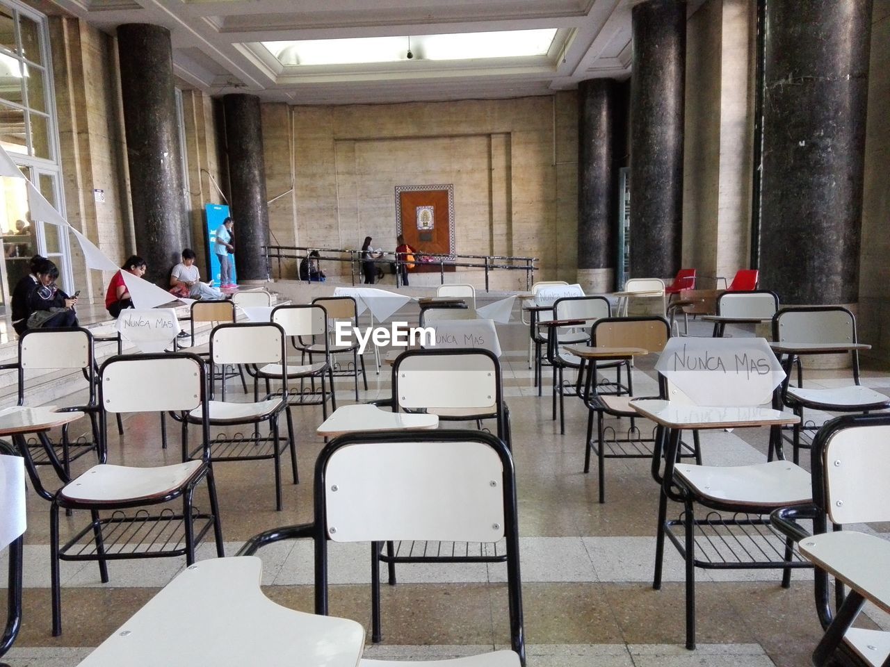 EMPTY CHAIRS AND TABLE IN ROOM