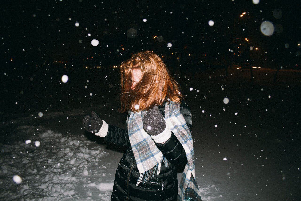 WOMAN STANDING IN SNOW COVERED WITH FIRE