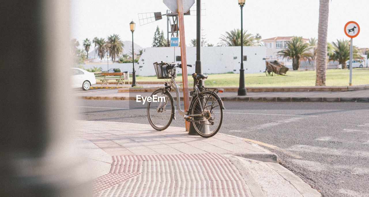 BICYCLE PARKED ON STREET