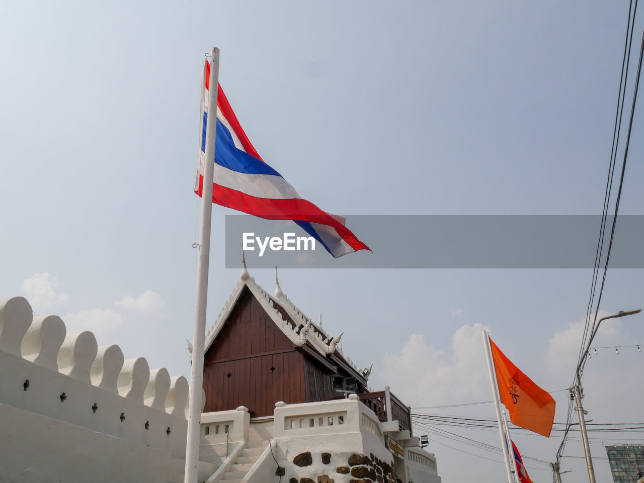 LOW ANGLE VIEW OF FLAGS FLAG AGAINST SKY