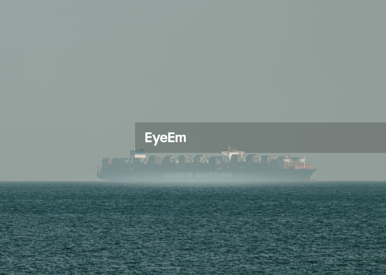 SCENIC VIEW OF SEA AGAINST SKY IN FOG