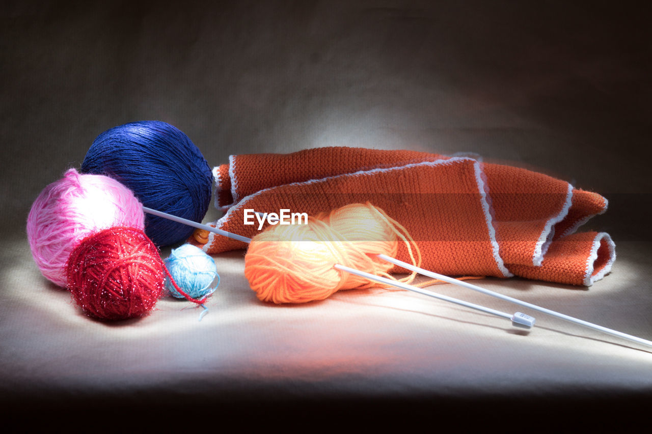 Close-up of multi colored wool on table