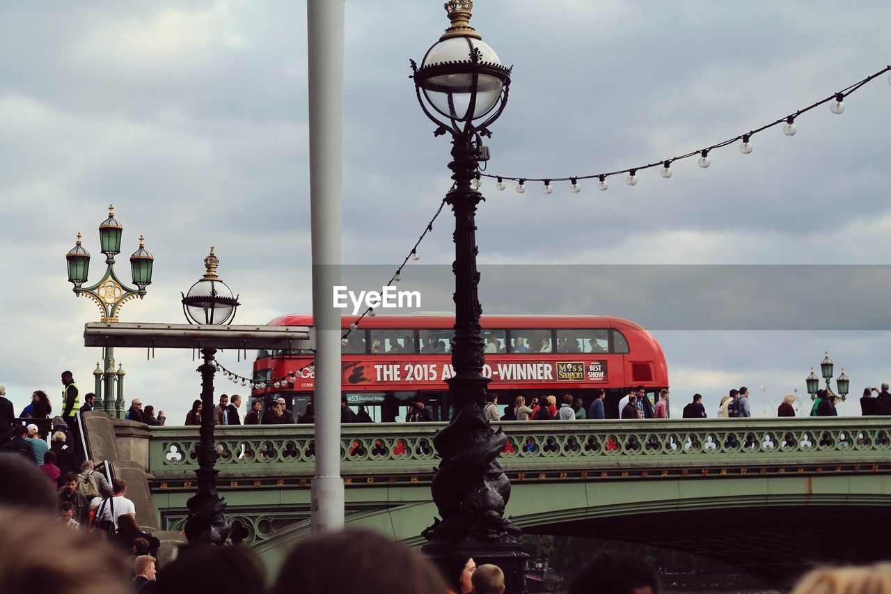 PEOPLE ON BRIDGE IN CITY