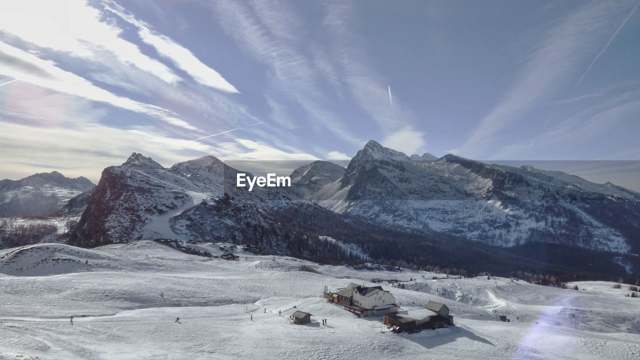 Scenic view of snowcapped mountains against sky