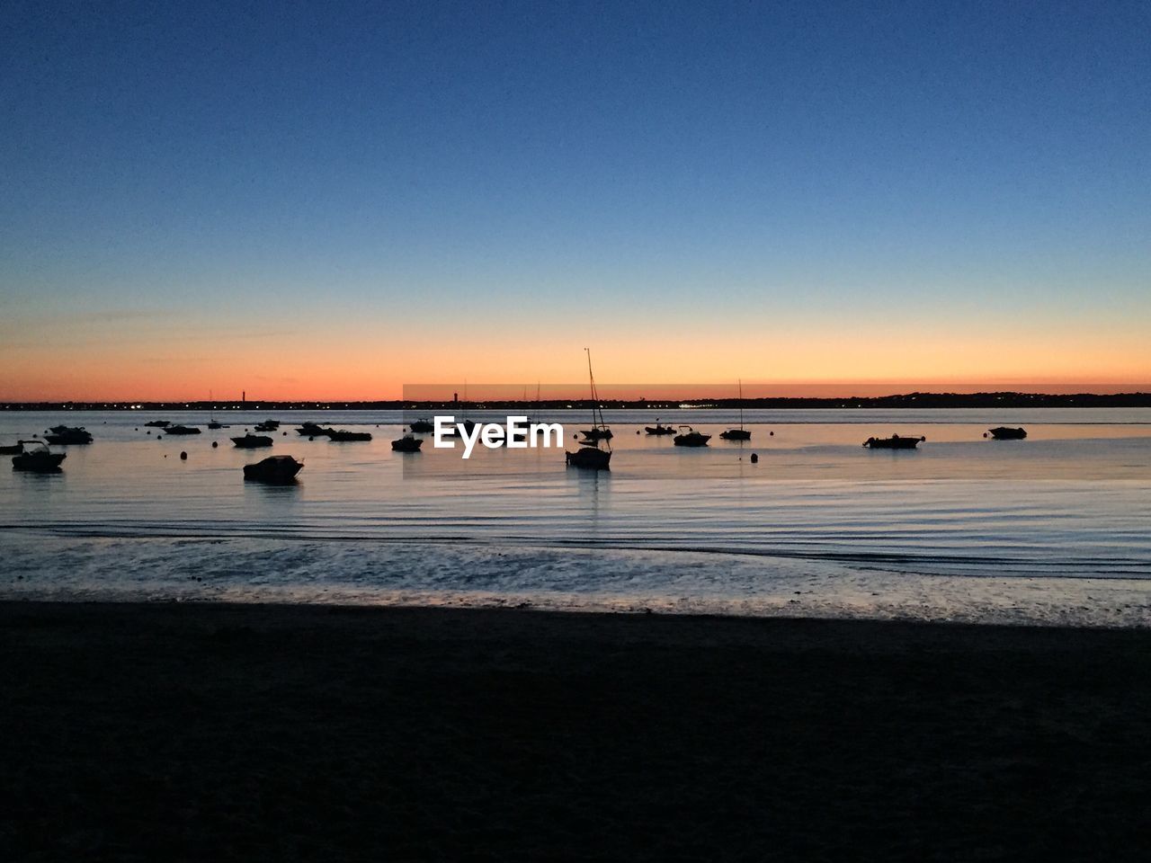 Scenic view of sea against sky at sunset