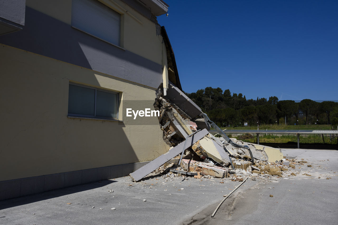 DAMAGED BUILDING AGAINST SKY