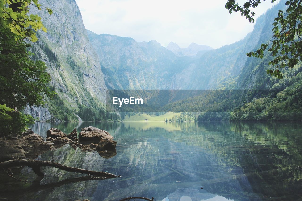 SCENIC VIEW OF LAKE AGAINST MOUNTAIN