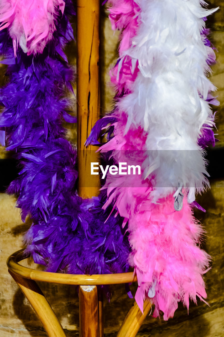 Close up of pink and purple feather boas