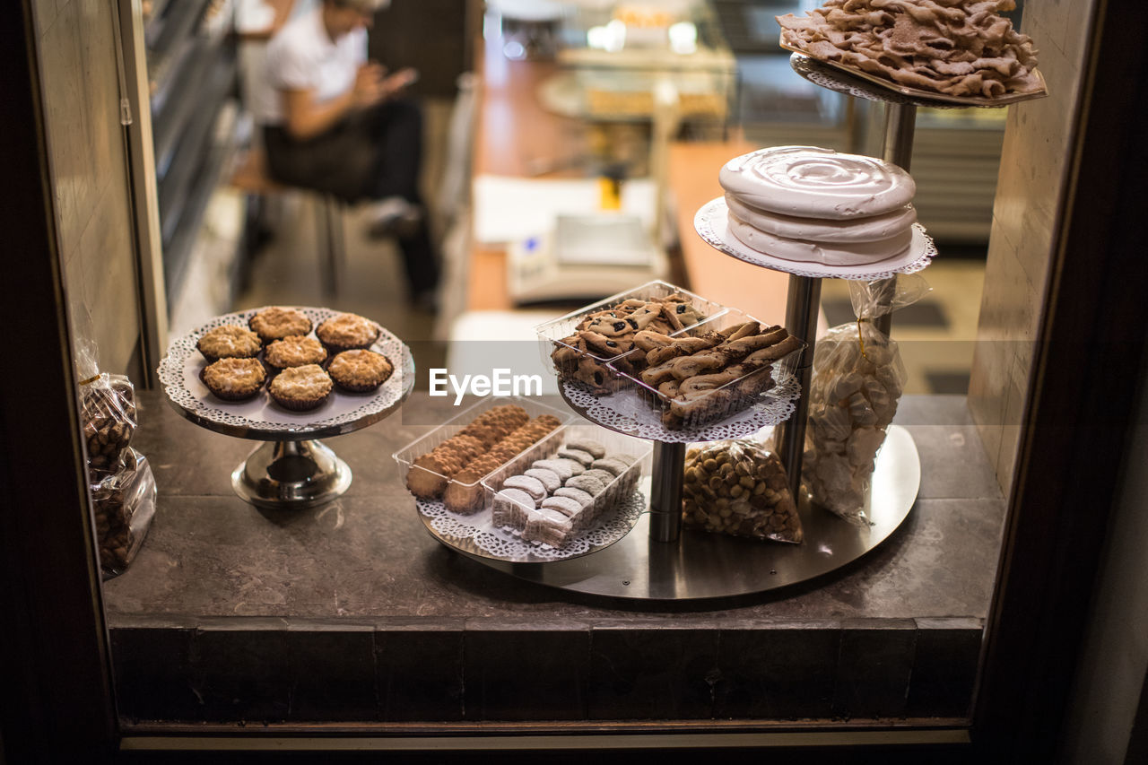 High angle view of various sweet food on window sill