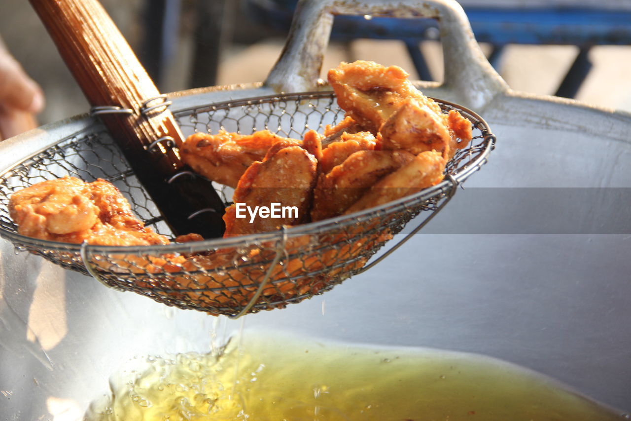 Close-up of meat in cooking pan on table