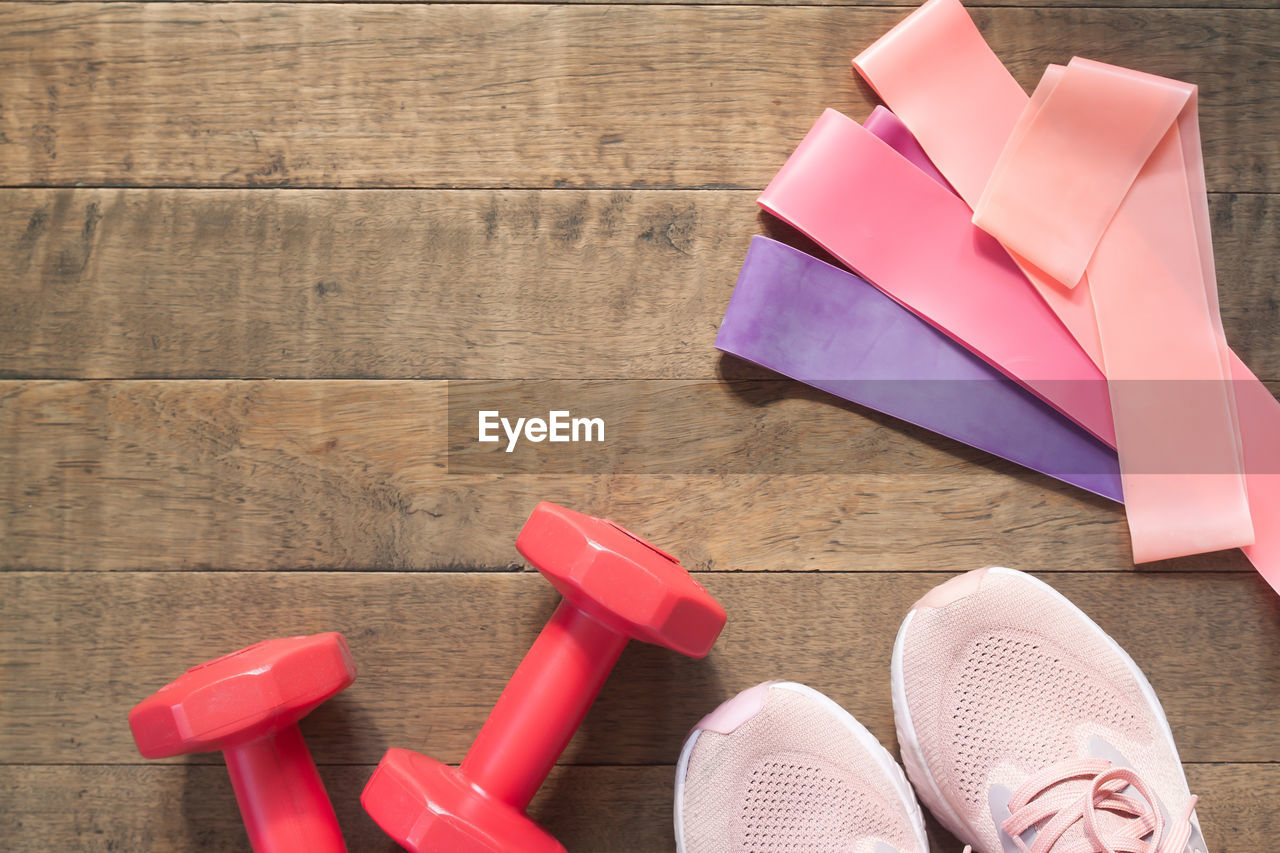 LOW SECTION OF MULTI COLORED SHOES ON TABLE