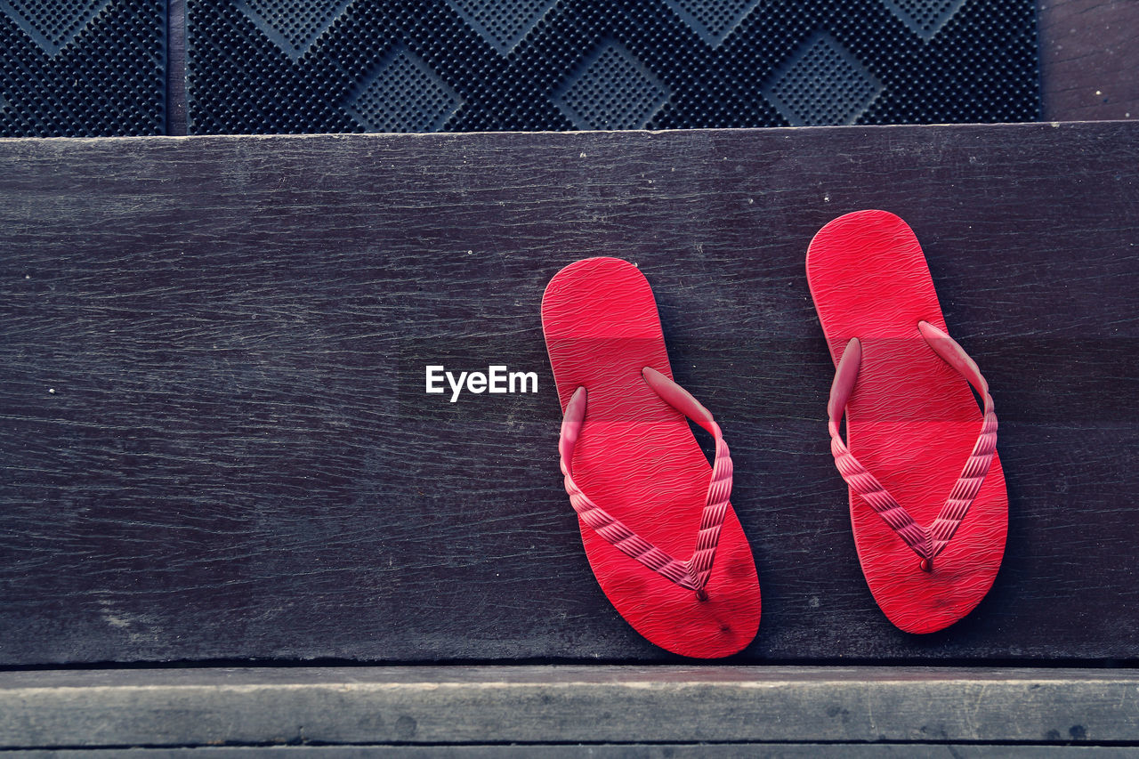 Directly above shot of red flip-flops on steps