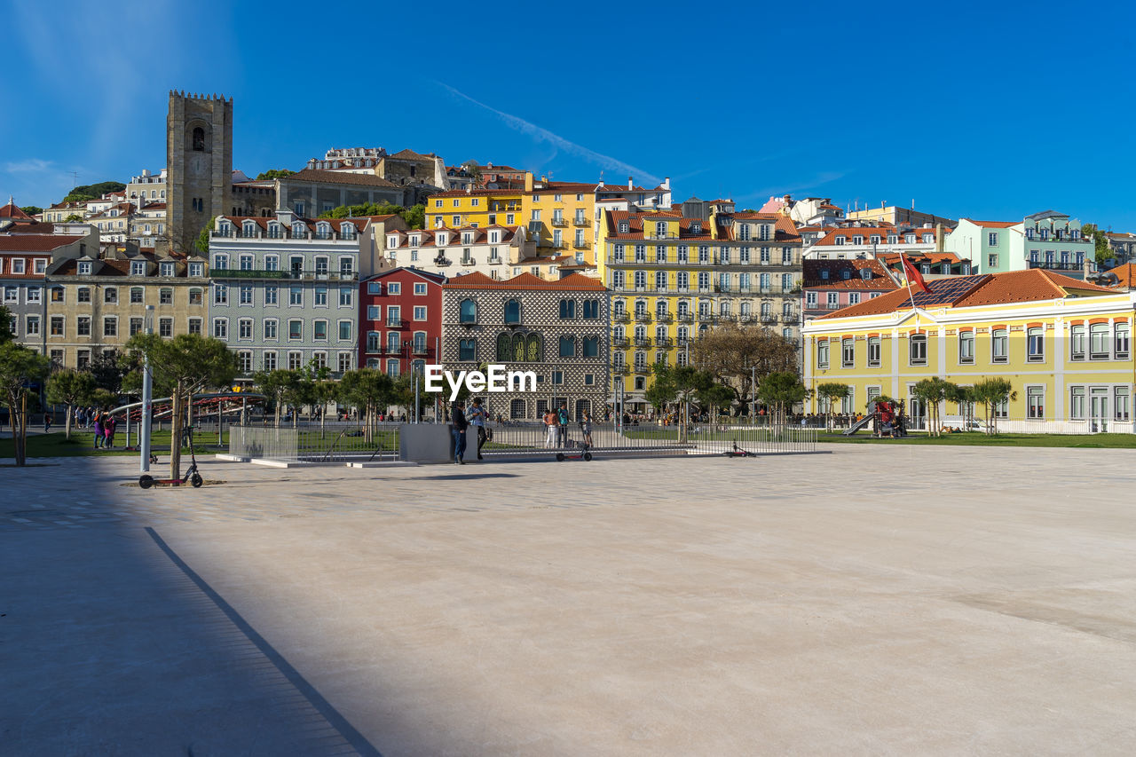 Square surrounded by colorful houses.
