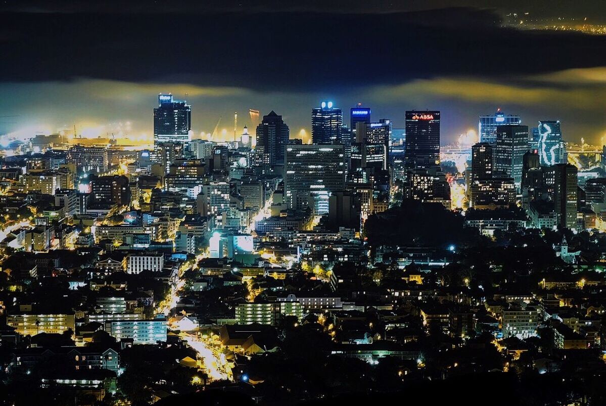 ILLUMINATED CITYSCAPE AT NIGHT