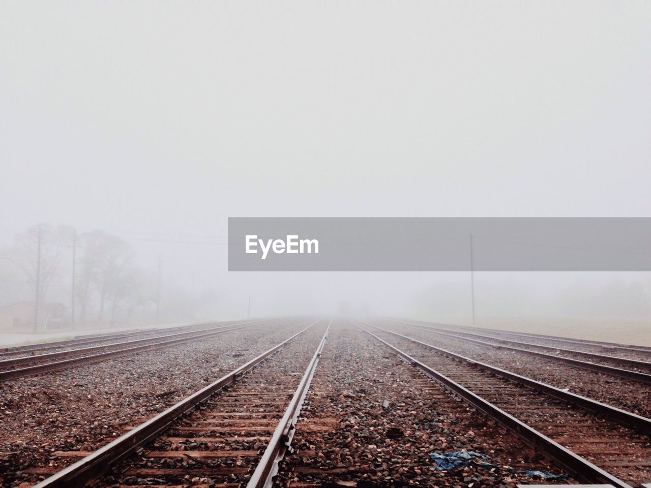 View of railroad tracks in fog