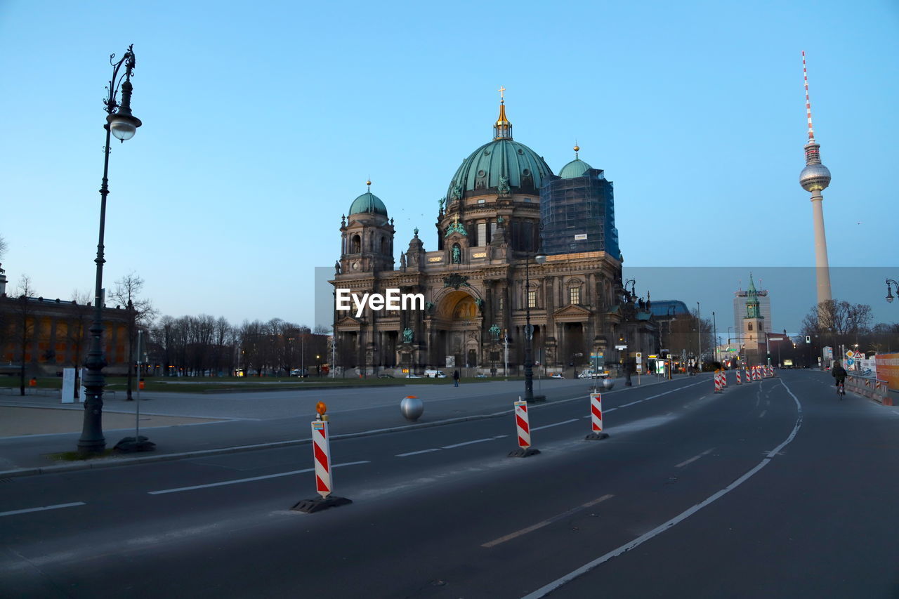 VIEW OF CITY STREET AGAINST SKY