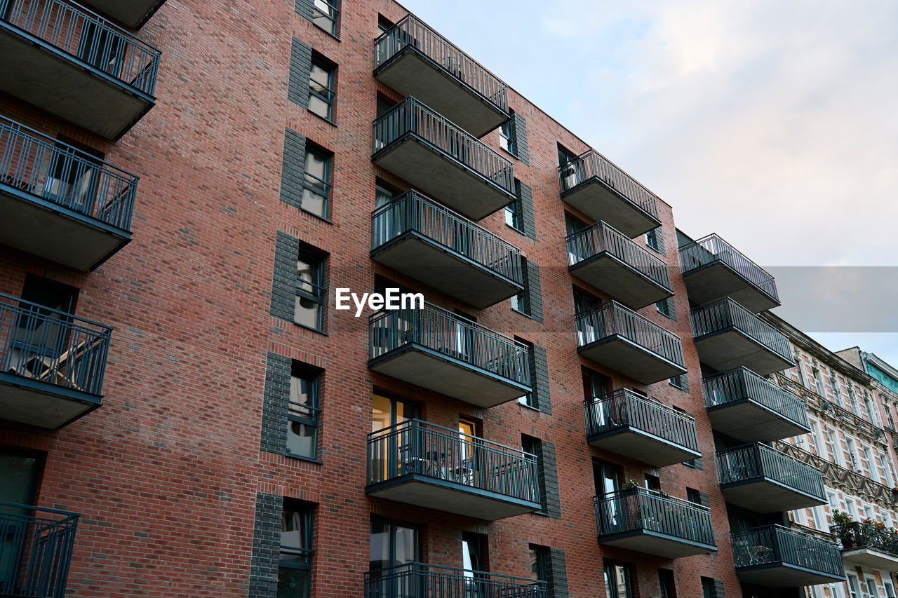 Residential building facade with balconies and windows. modern city architecture. apartment building