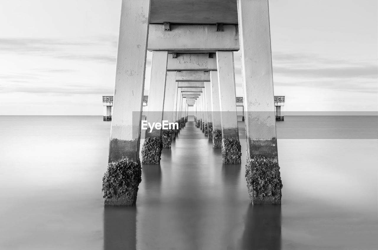 Scenic view of pier over sea against sky