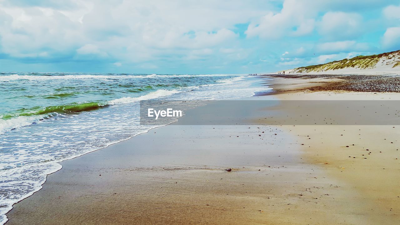 Scenic view of beach against sky