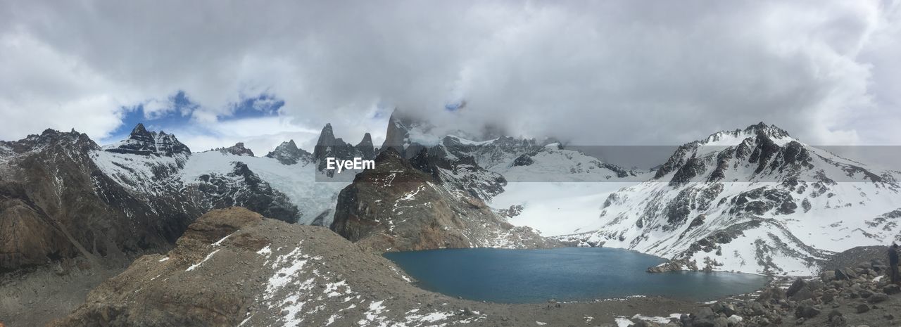 PANORAMIC SHOT OF SNOWCAPPED MOUNTAIN AGAINST SKY