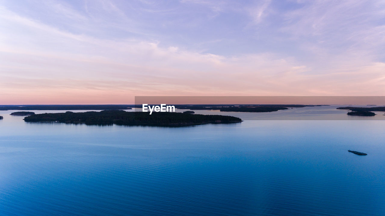 Scenic view of sea against sky at sunset