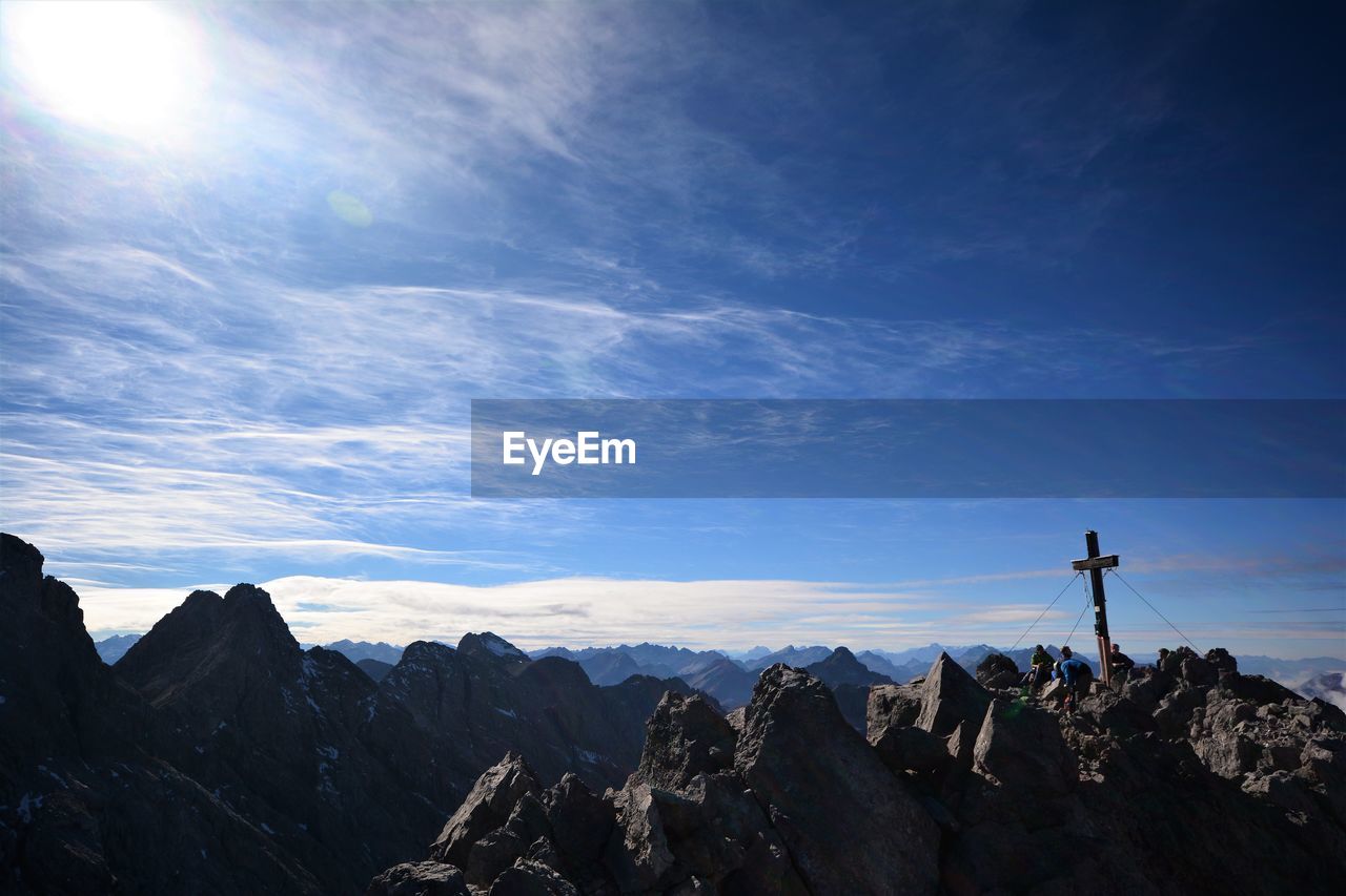 Panoramic view of mountains against blue sky