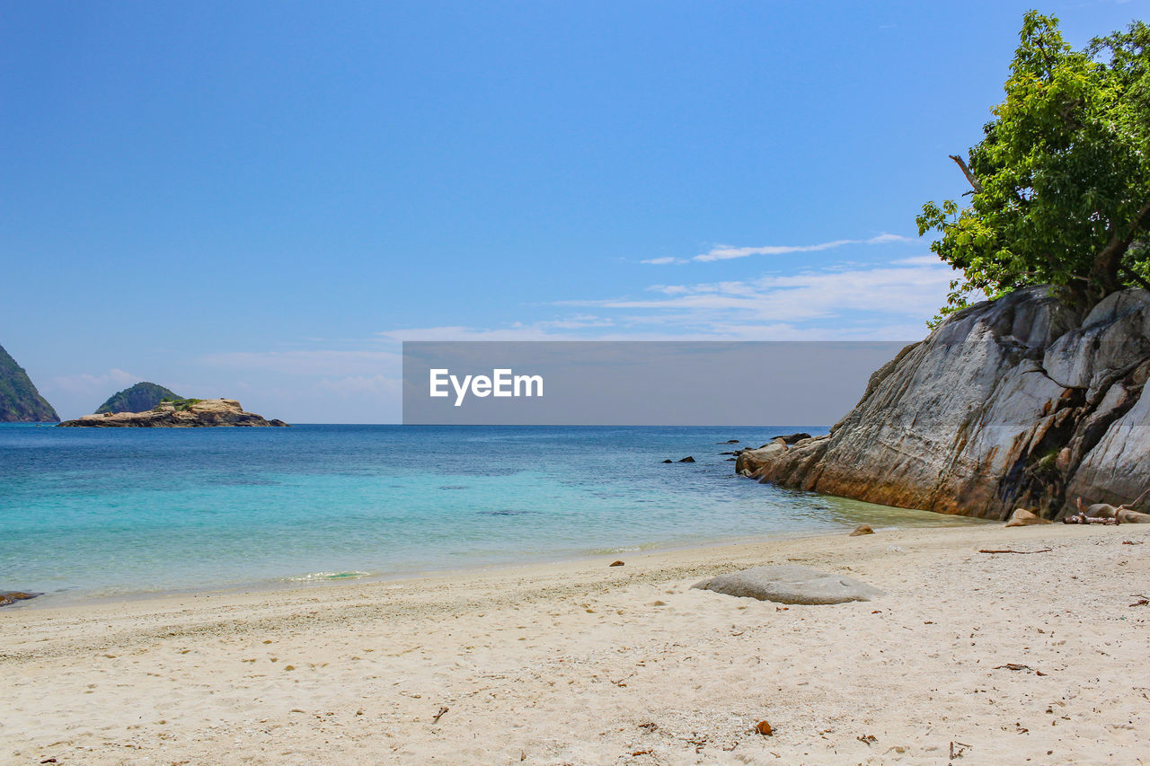 Scenic view of sea against blue sky