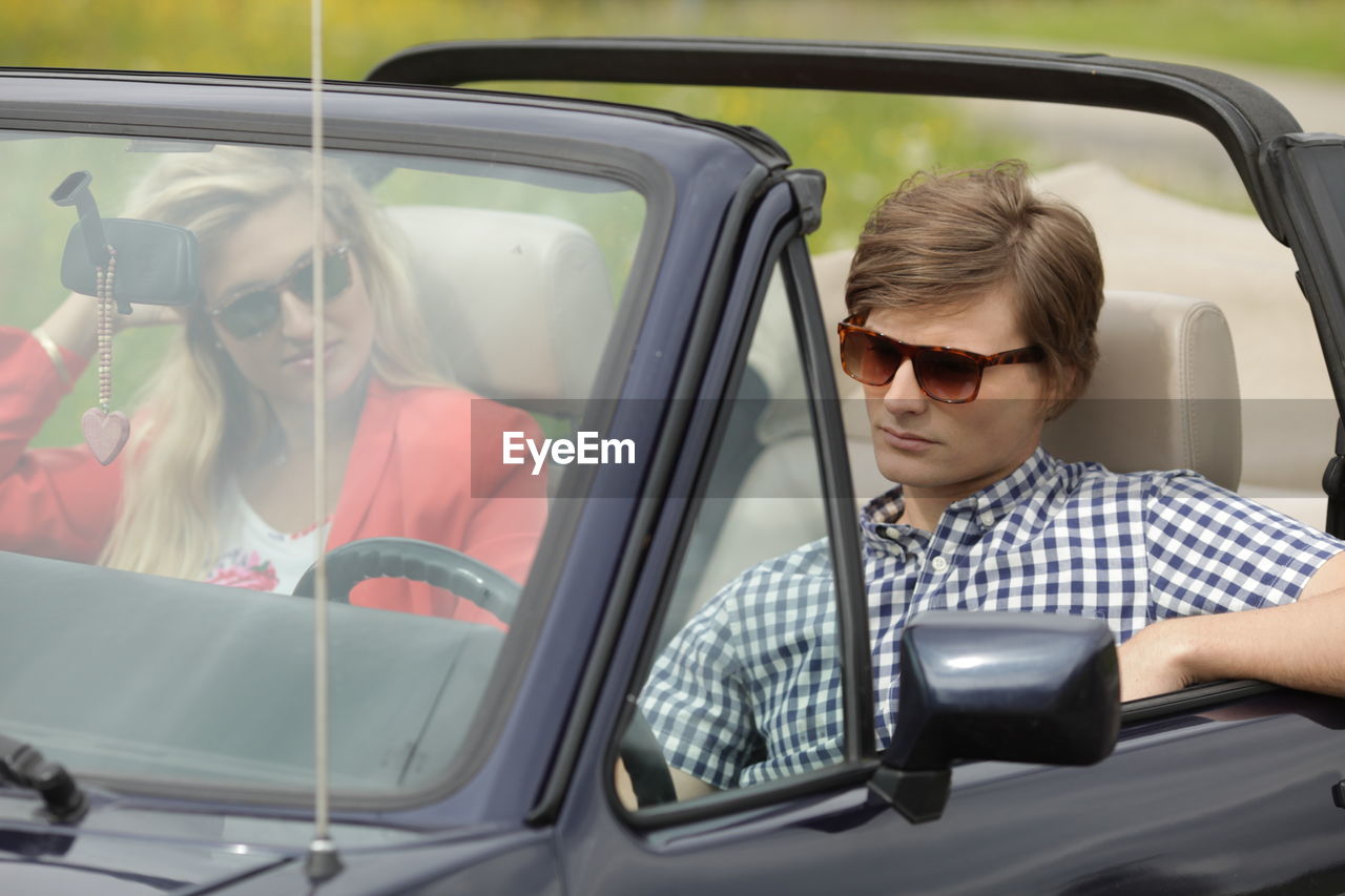 Young couple traveling in car