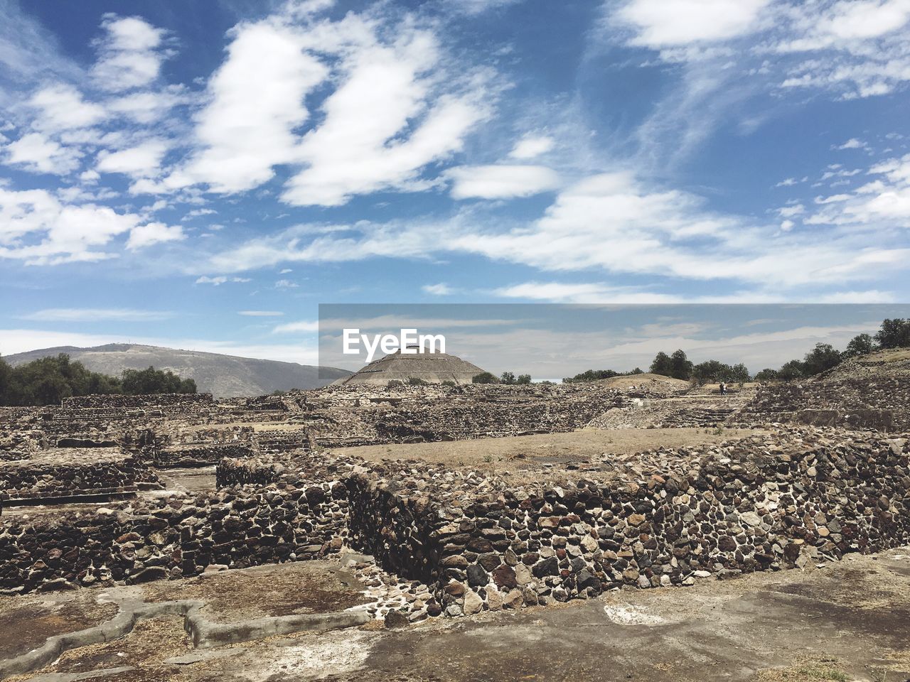 Scenic view of ruins against cloudy sky