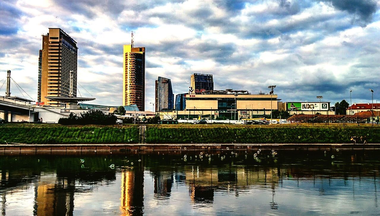 RIVER WITH BUILDINGS IN BACKGROUND