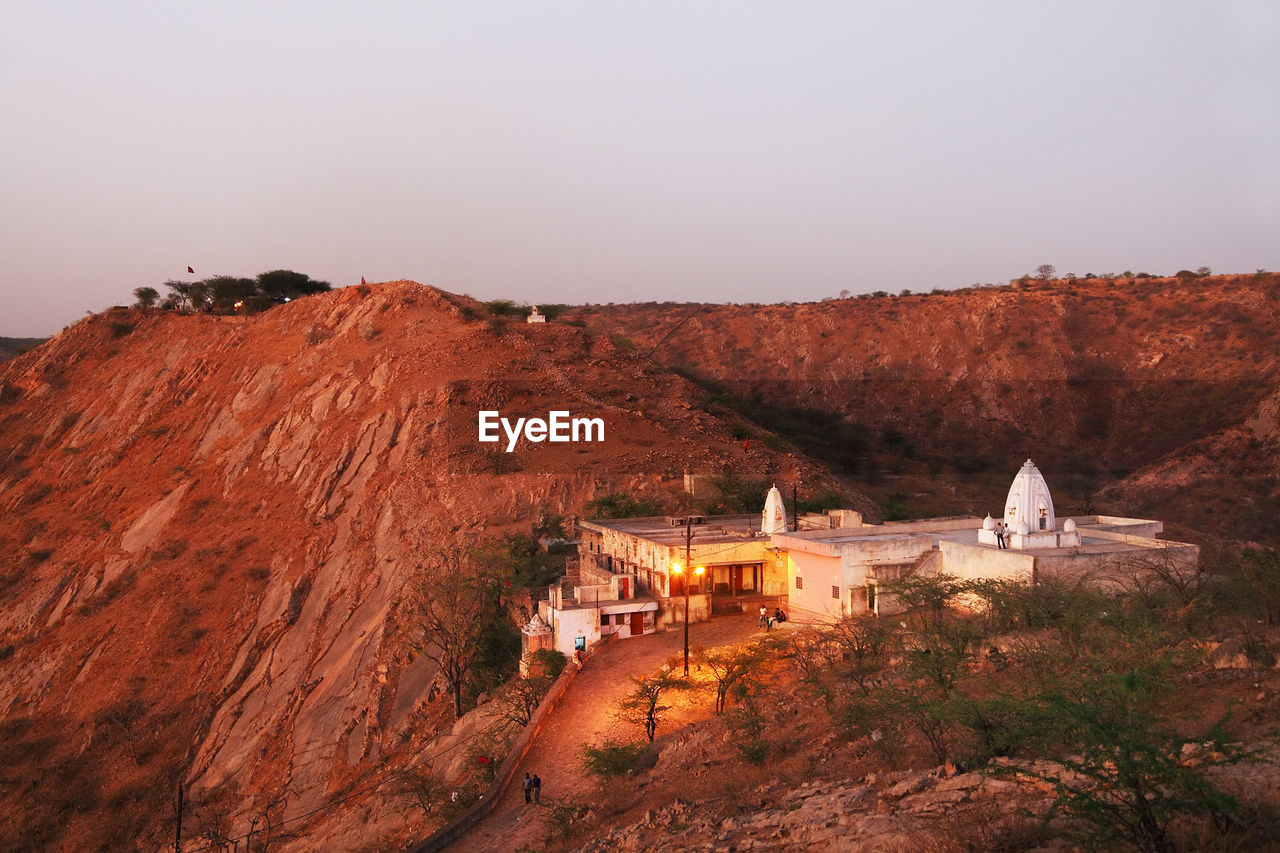 High angle view of temple on mountain against sky at dusk