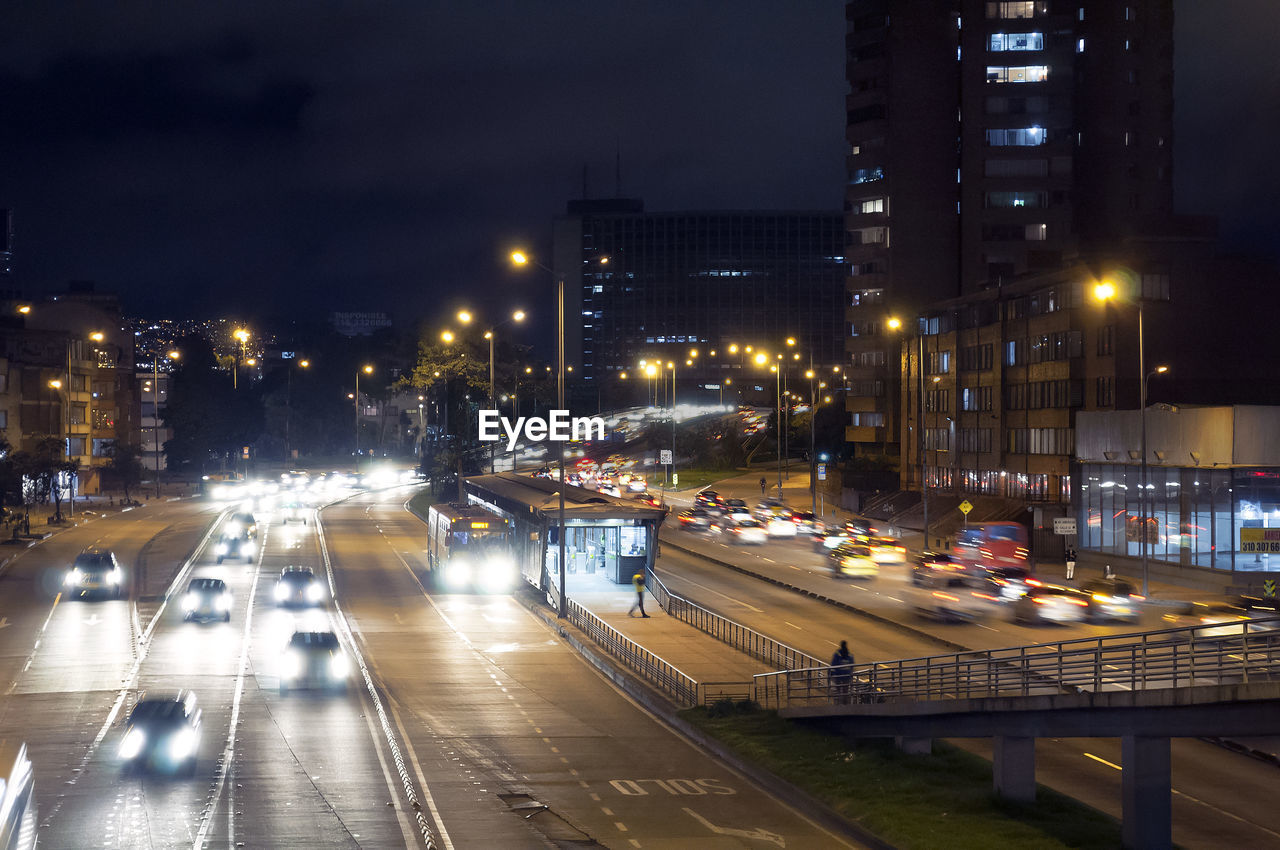 HIGH ANGLE VIEW OF TRAFFIC ON ROAD IN CITY