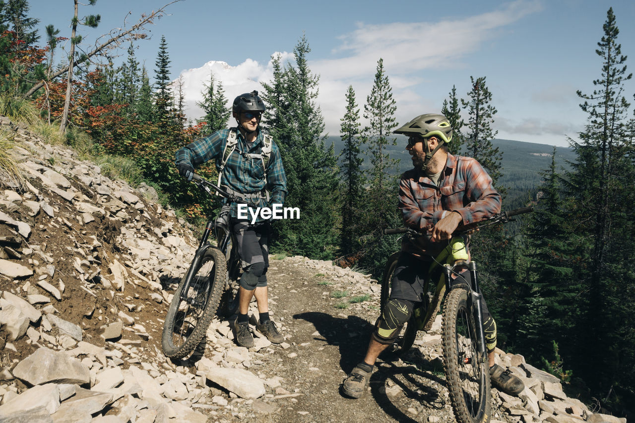 Two bikers take a break on the trail at the timberline bike park in or