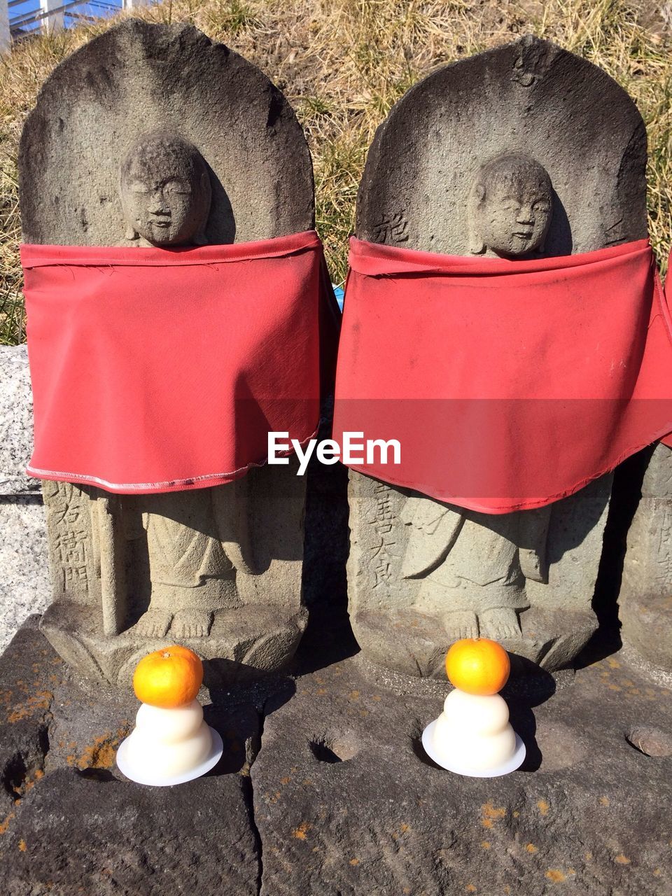 Jizo statues covered with red fabrics