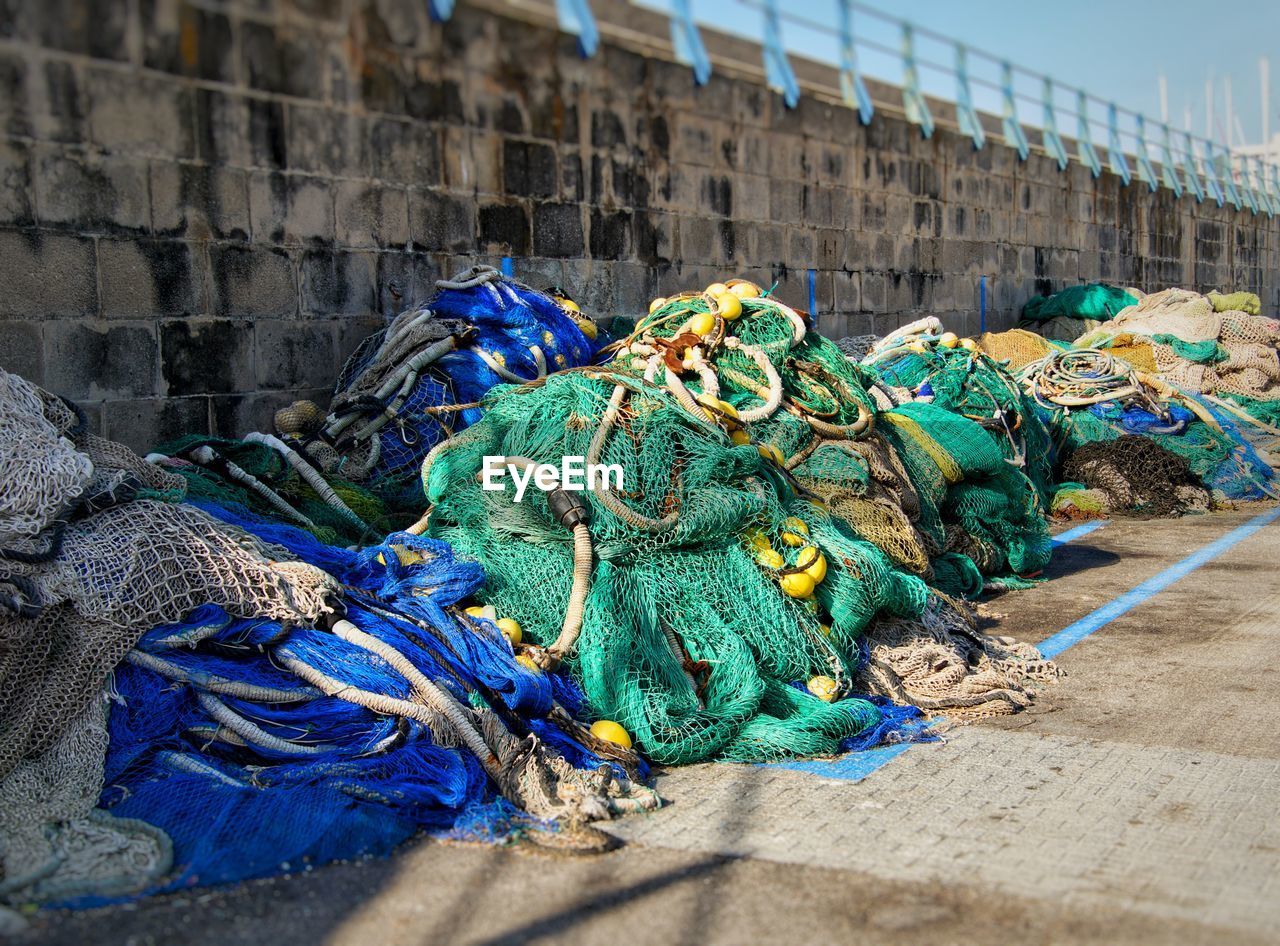 Multi colored fishing net against wall