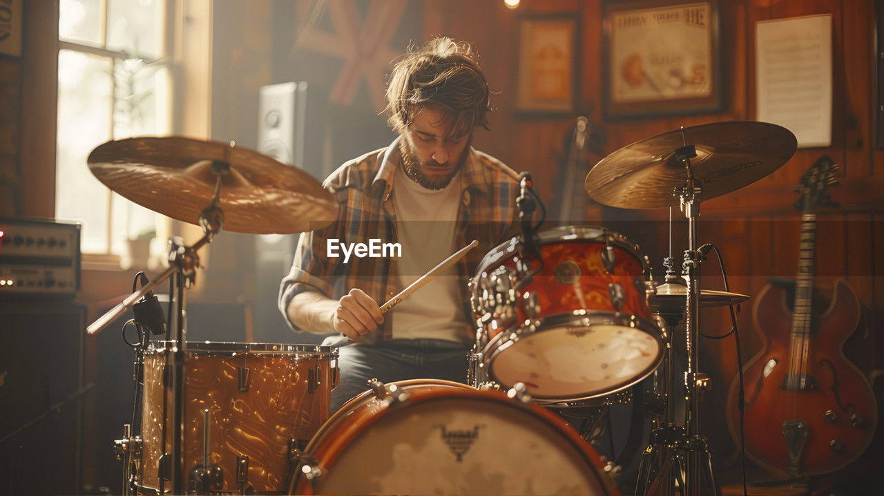 cropped image of man playing drum