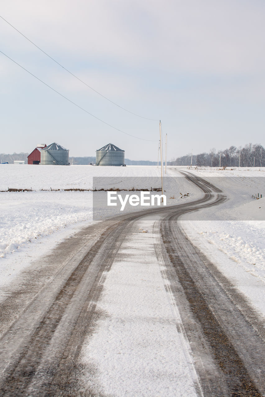 empty road against cloudy sky