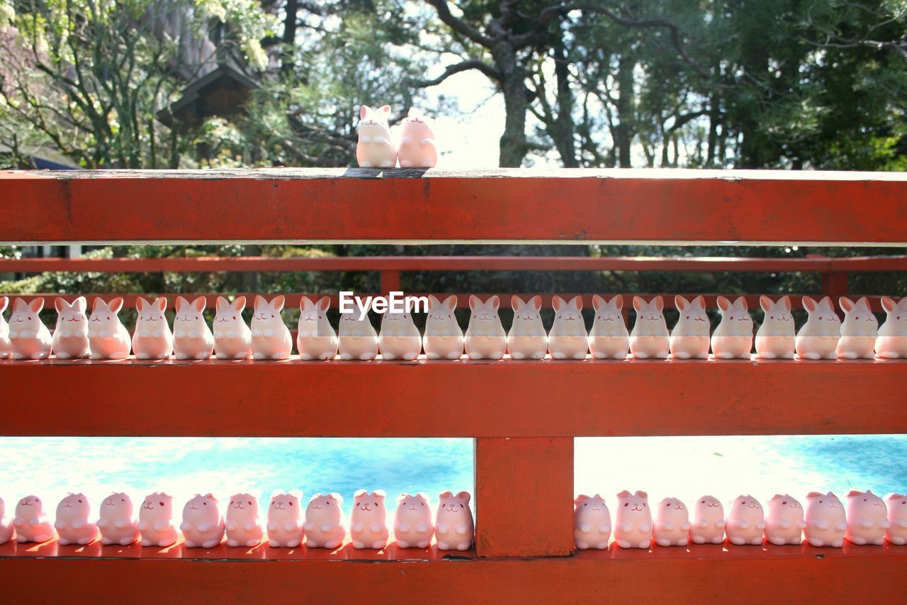 Stuffed toys arranged on shelves for sale at market