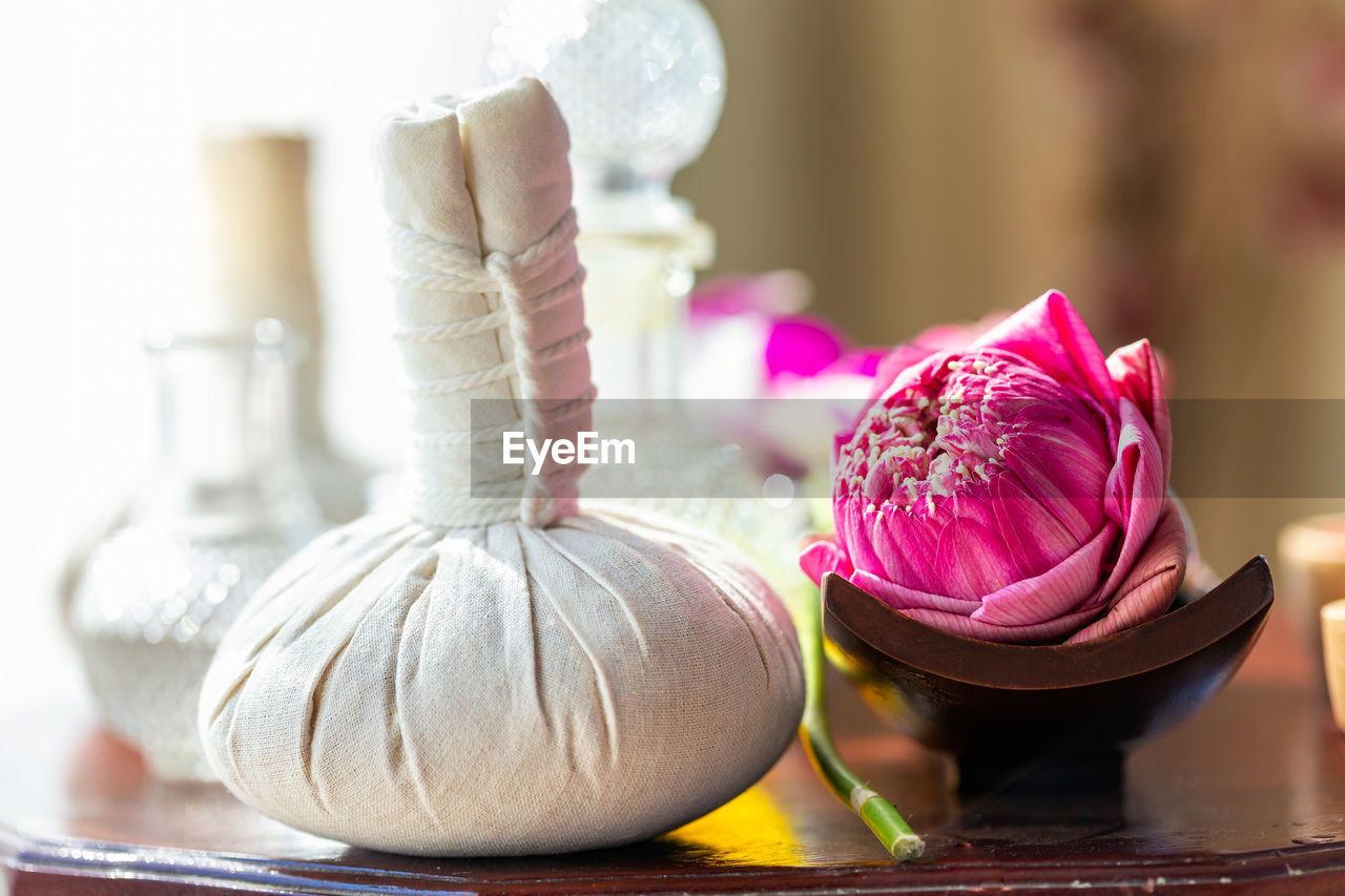 Hot compress massage. spa compress ball and lotus flower.