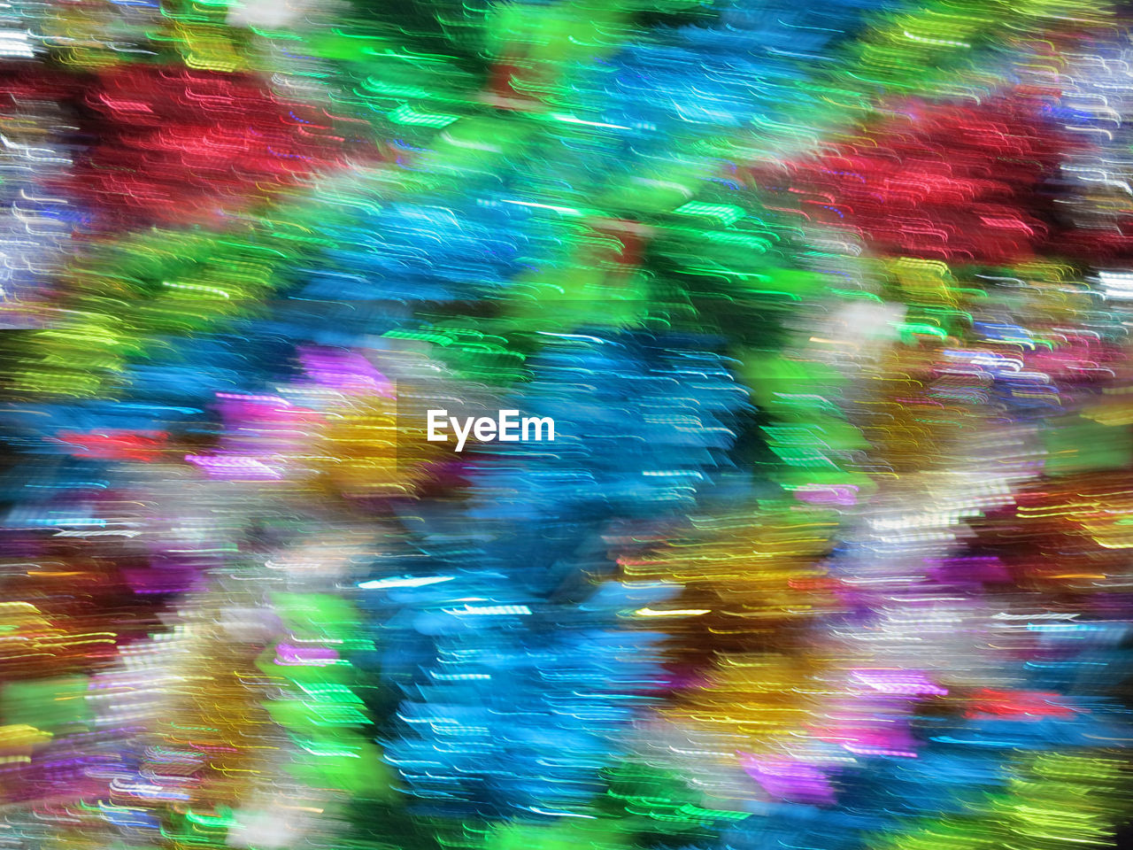 DEFOCUSED IMAGE OF MULTI COLORED LIGHT