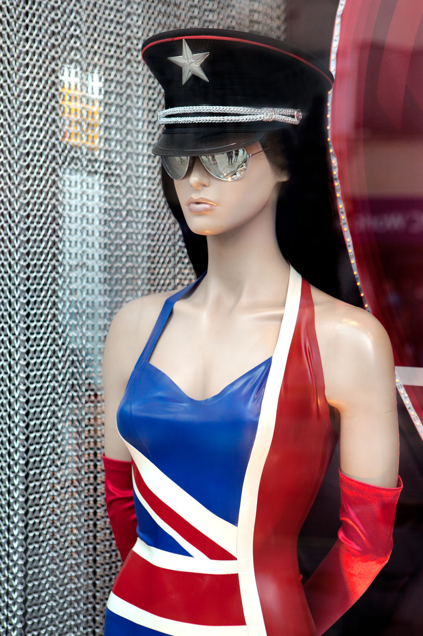 Fashionable mannequin wearing sunglasses at store