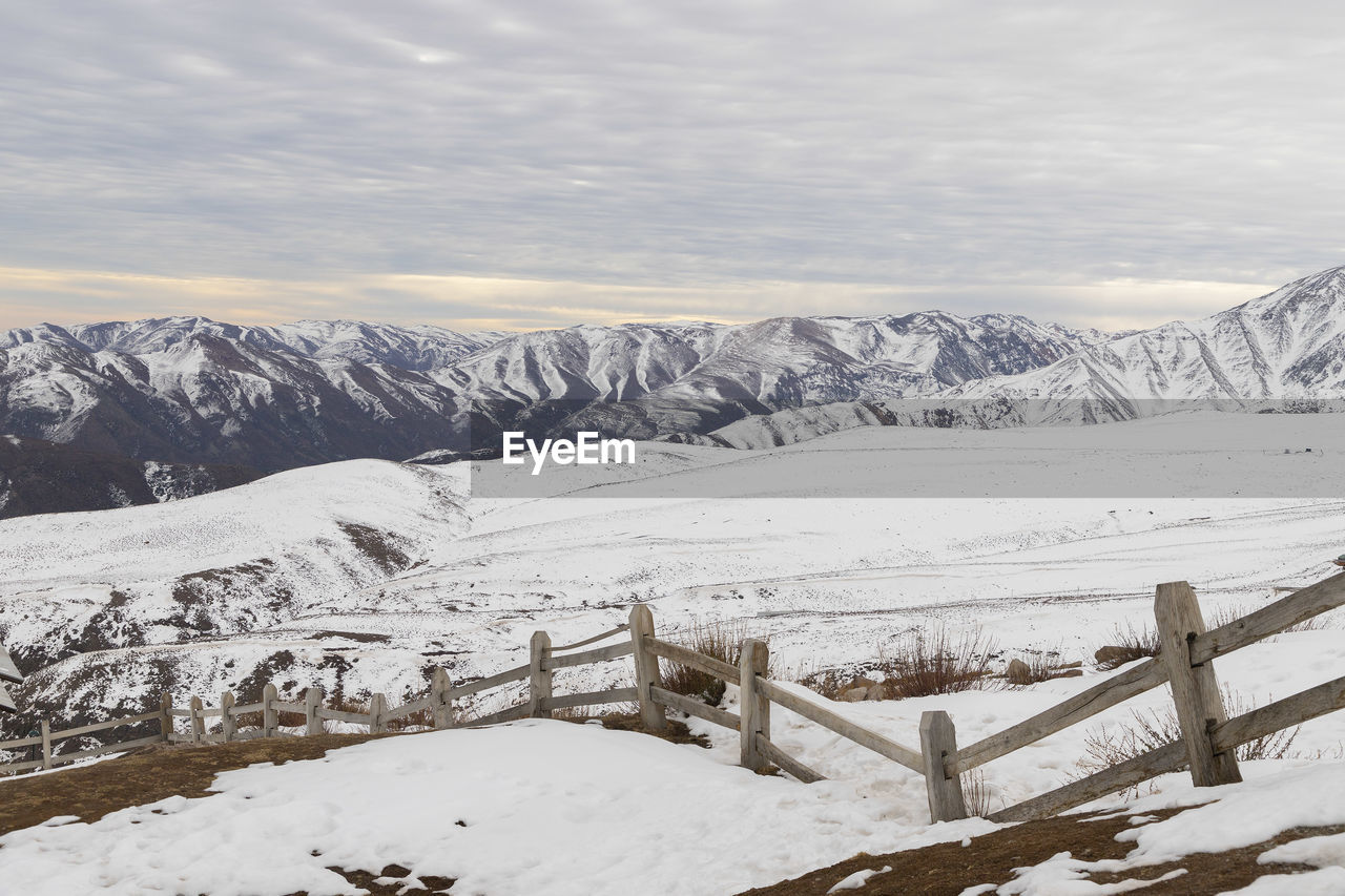 Scenic view of snowcapped mountains against sky