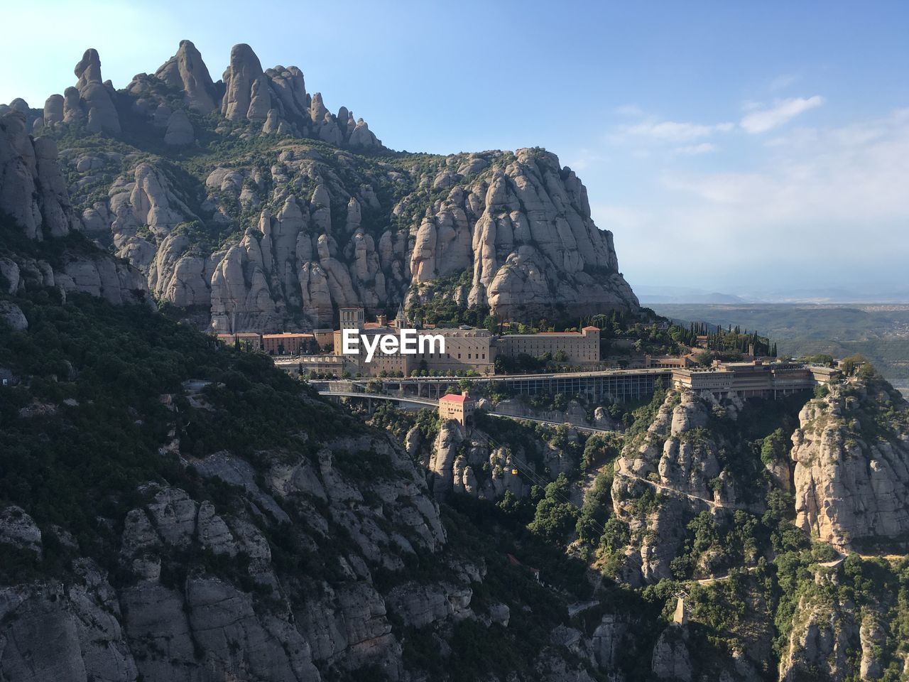 Panoramic view of montserrat rocks and mountains against sky